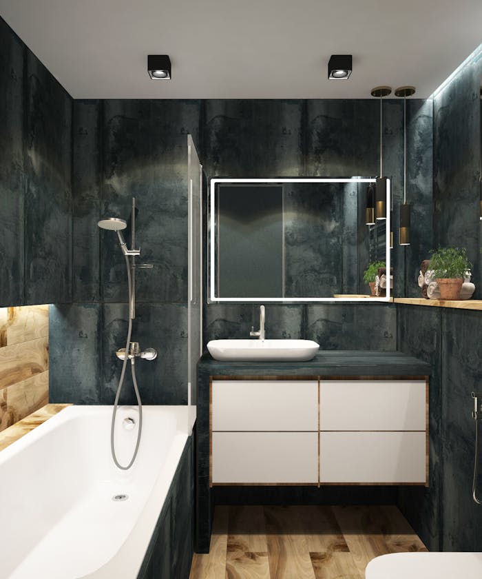 A contemporary bathroom showcasing black marble walls, clean lines, and modern fixtures, exuding luxury and style.